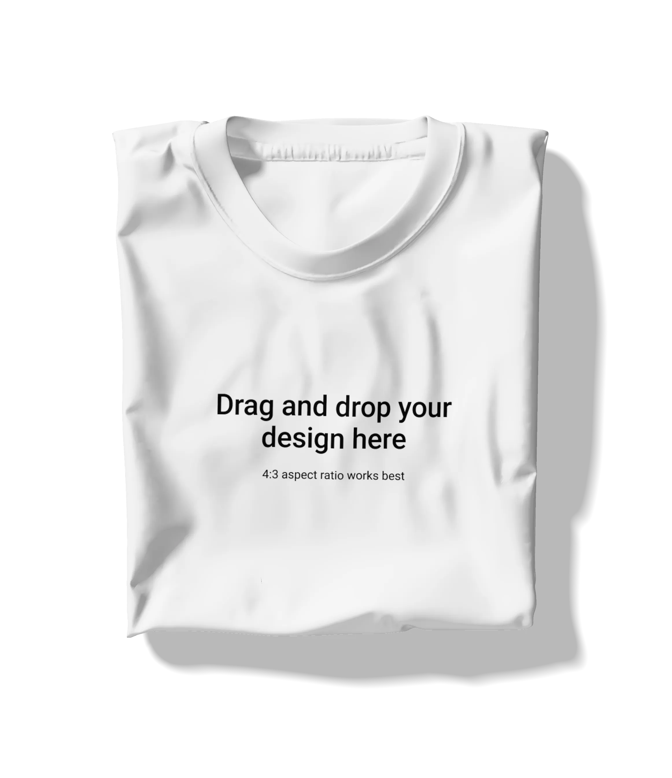 White folded t-shirt mockup with text saying 'Drag and drop your design here'.